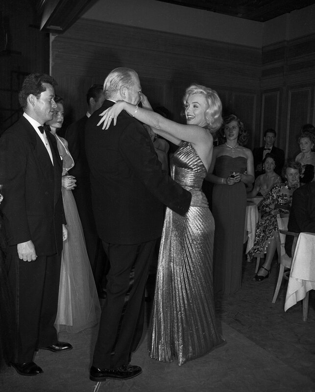 Marilyn Monroe dancing with a man