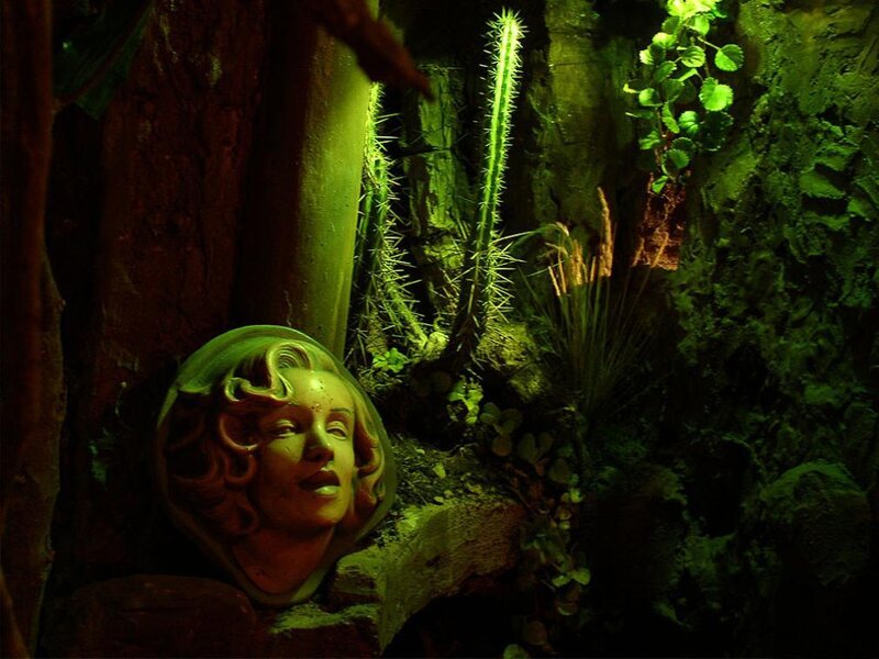 Marilyn Monroe head sculpture in jungle