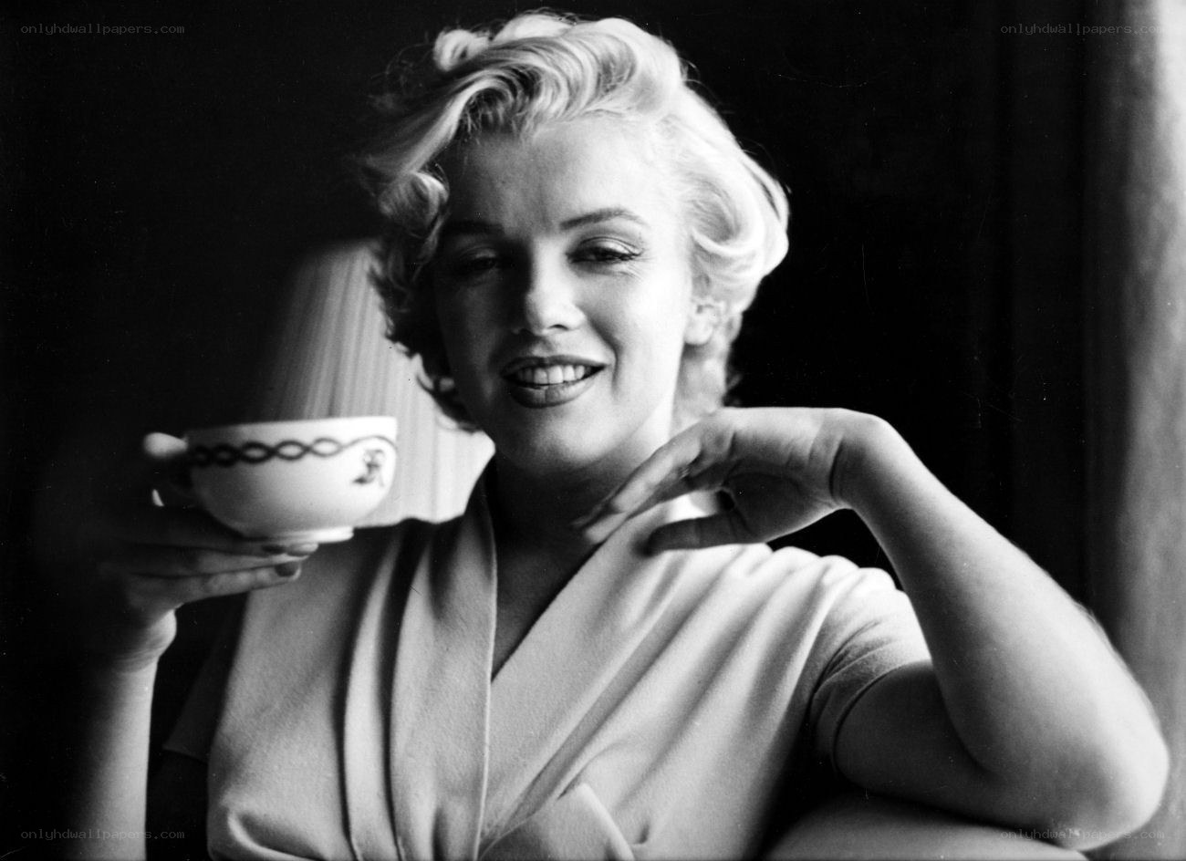 Marilyn Monroe holding a teacup