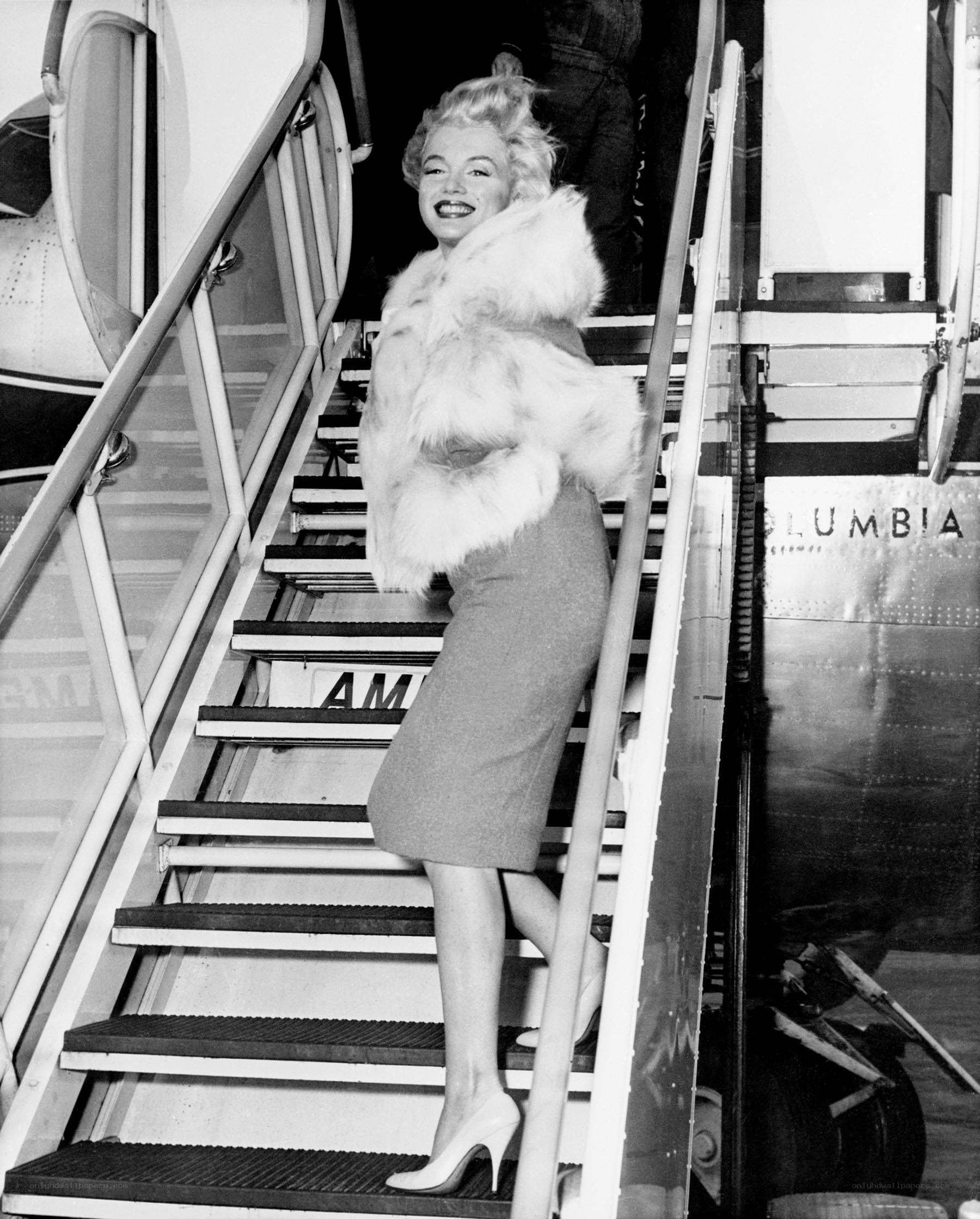 Marilyn Monroe on airplane stairs