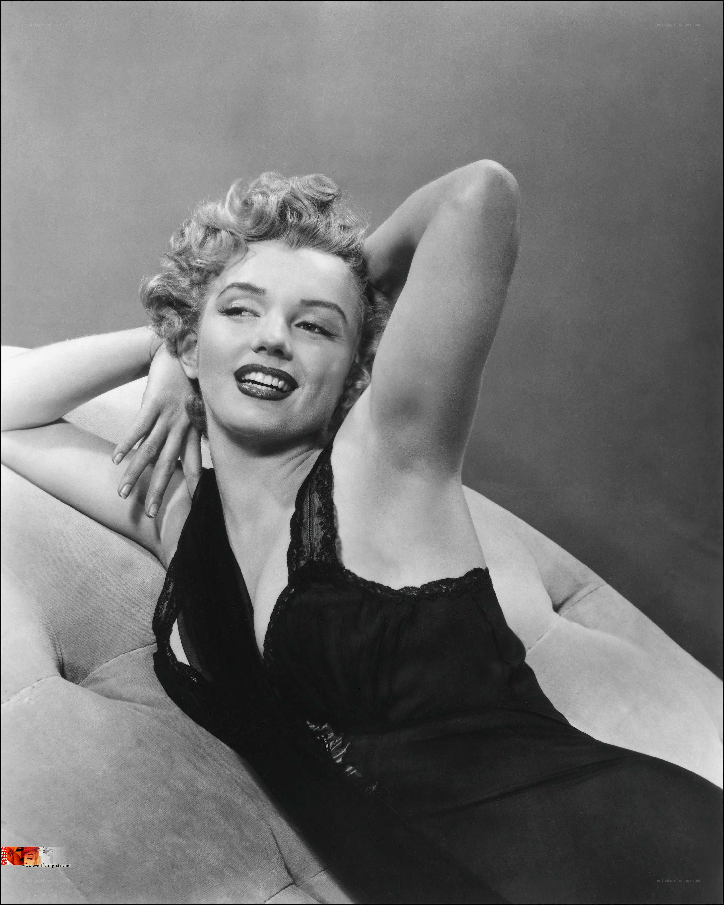 Marilyn Monroe reclining on sofa