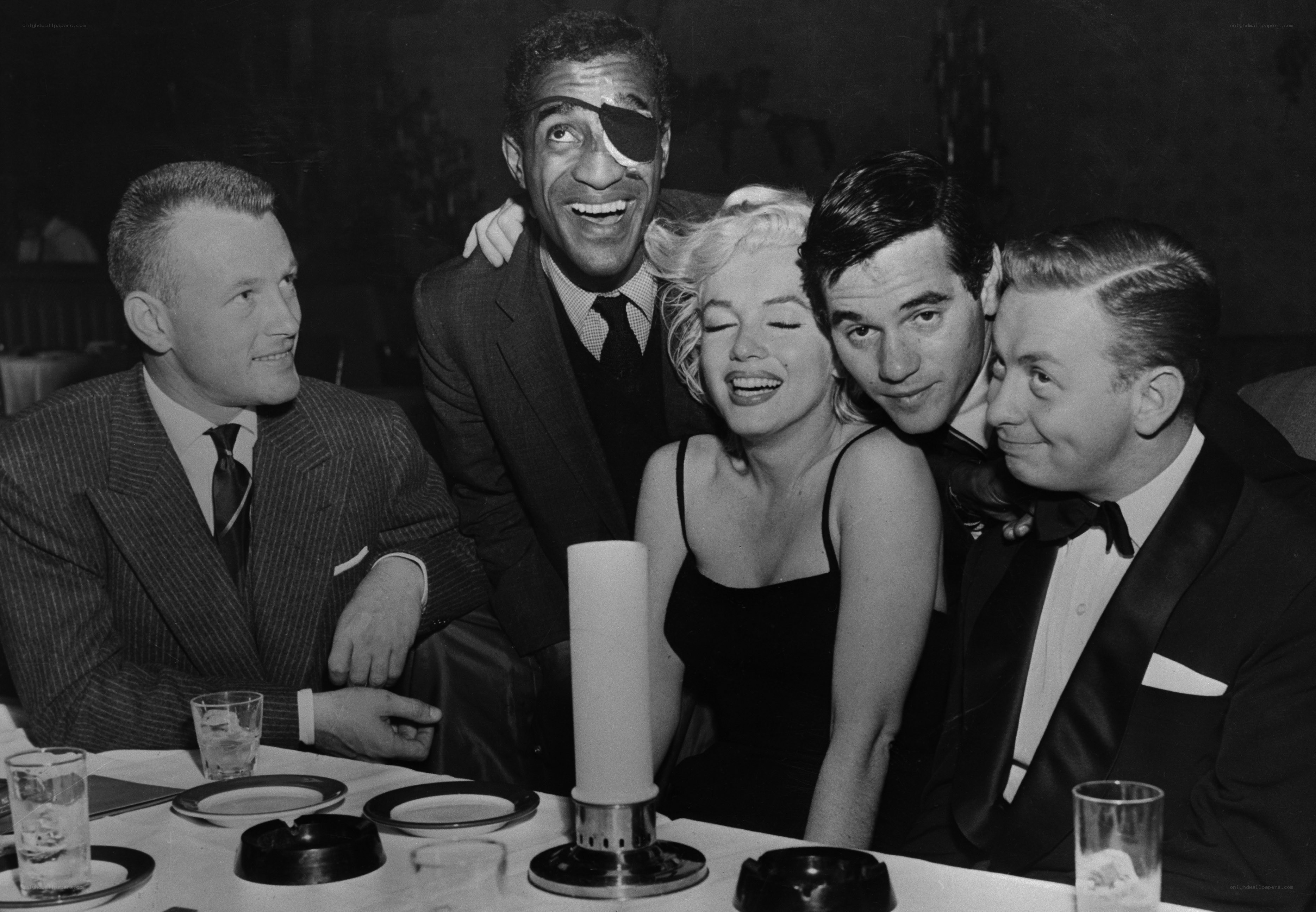 Marilyn Monroe with friends at dinner