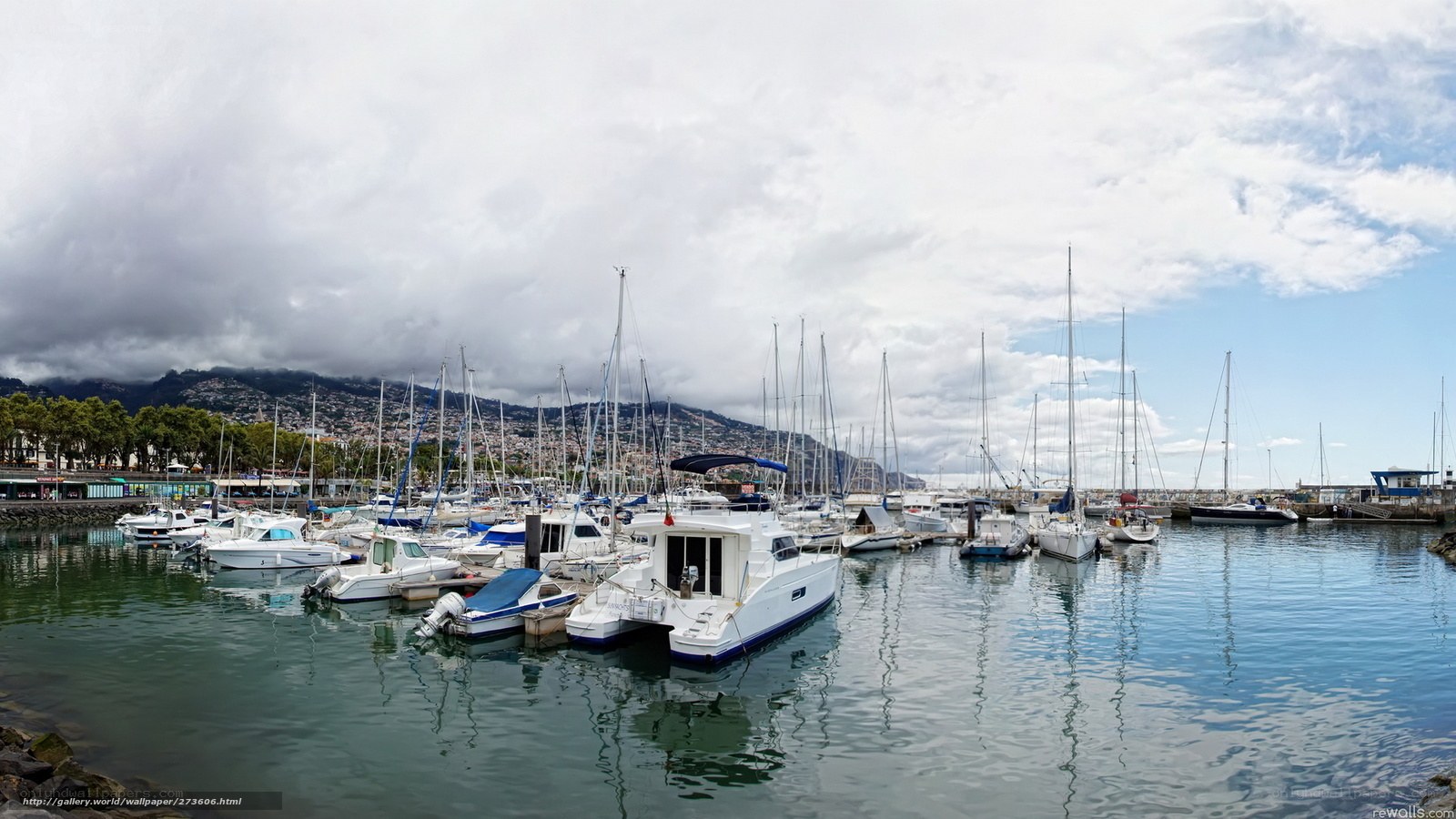 Marina with sailboats and mountains