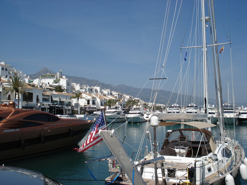 Marina with yachts and white buildings