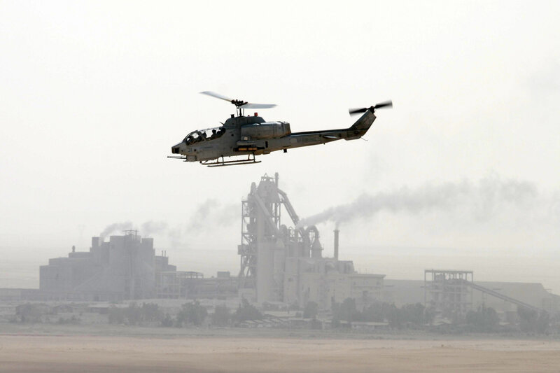 Marine helicopter over industrial area