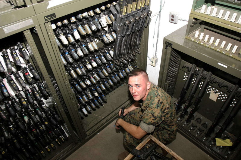Marine in armory with weapons