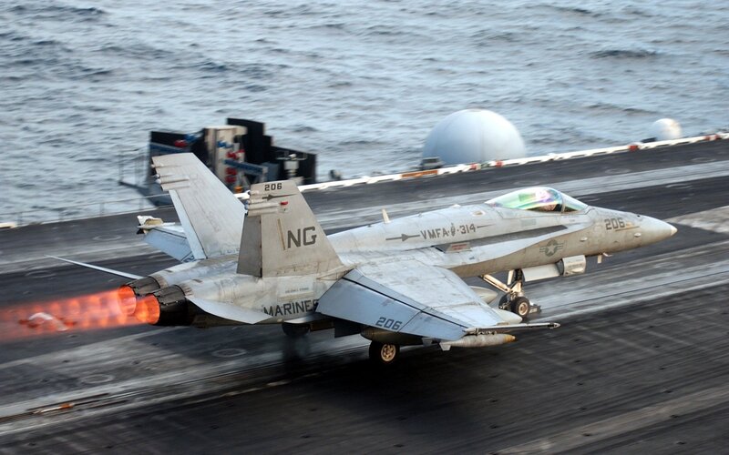 Marine jet taking off from aircraft carrier