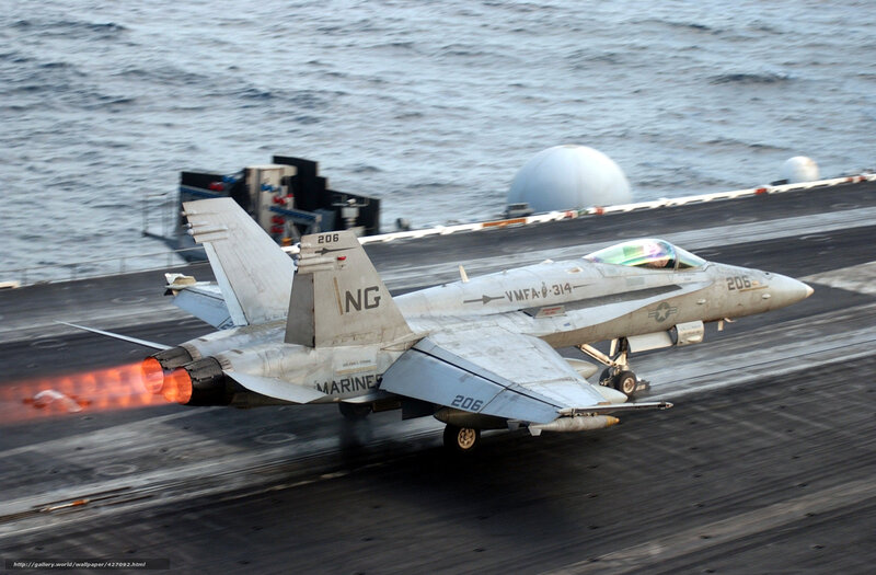 Marine jet taking off from aircraft carrier