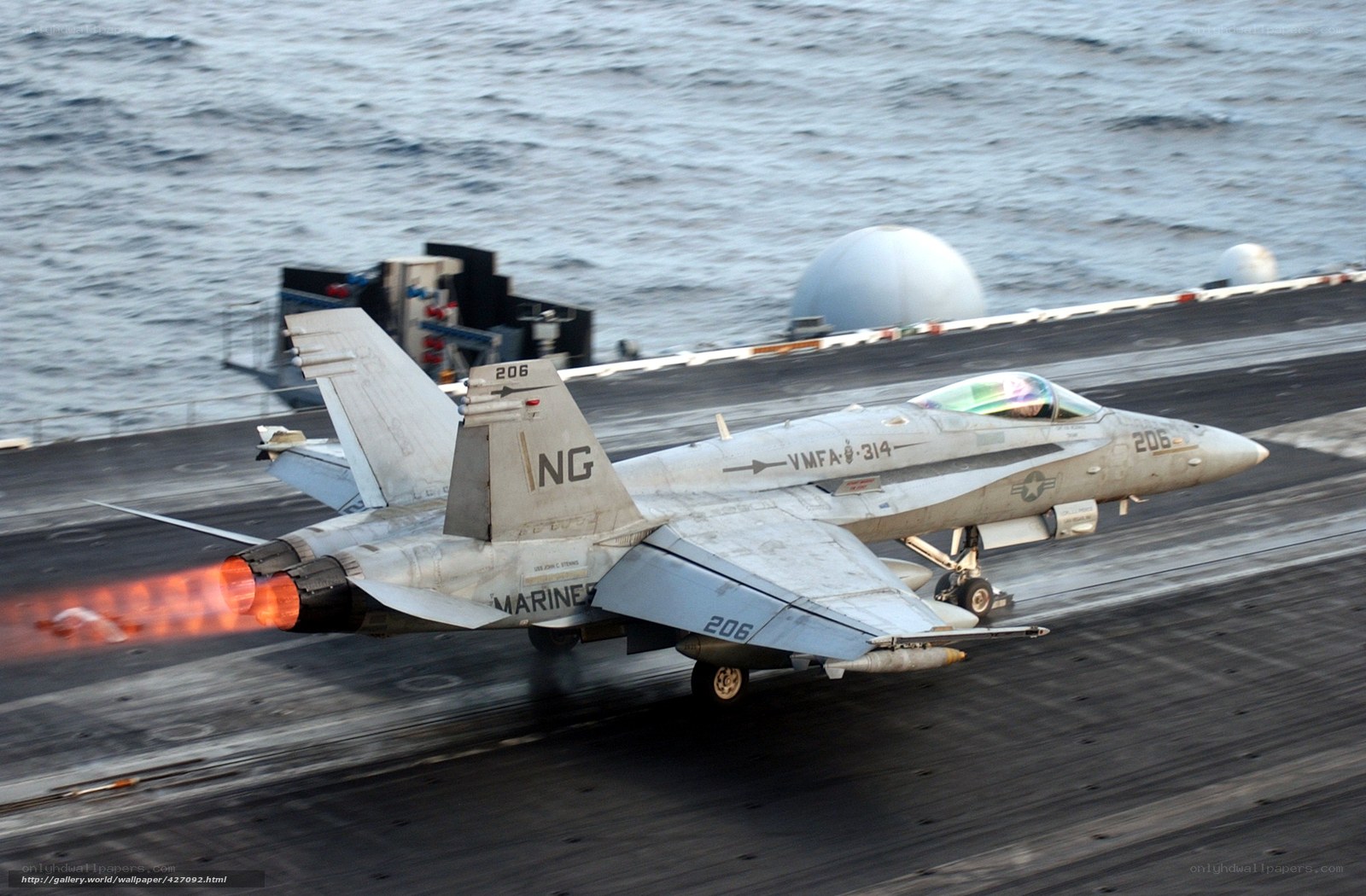 Marine jet taking off from aircraft carrier