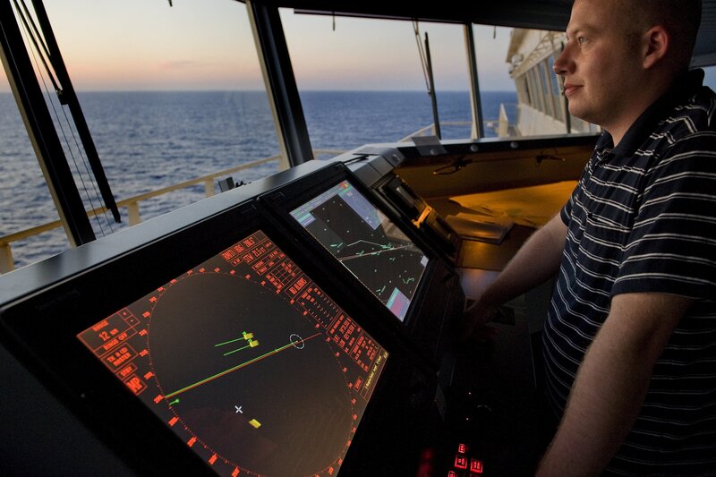Marine radar operator at helm