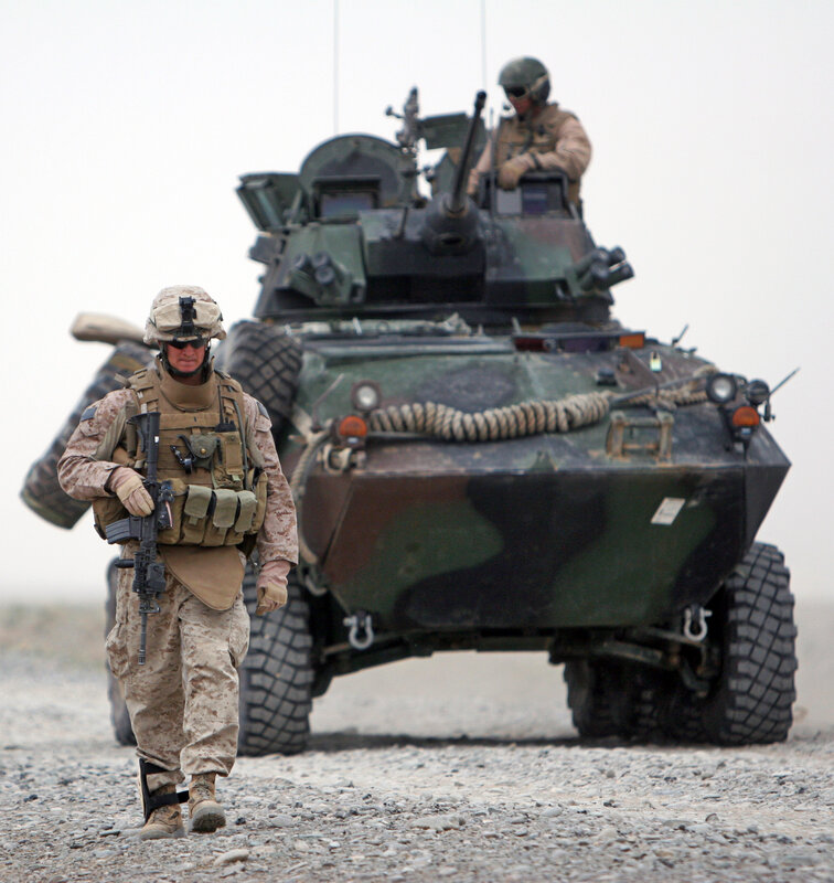 Marine with armored vehicle