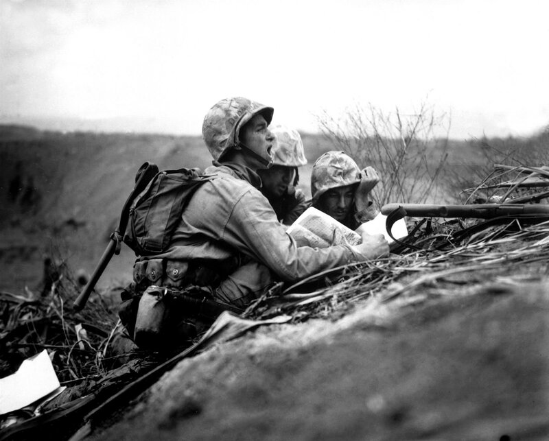 Marines in foxhole with map