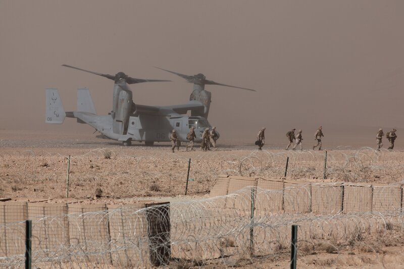 Marines near MV-22 Osprey in desert