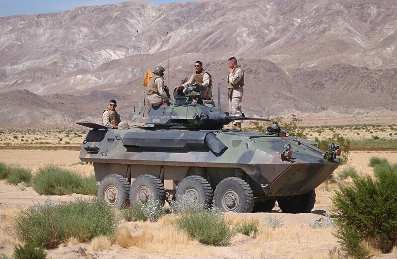 Marines on armored vehicle