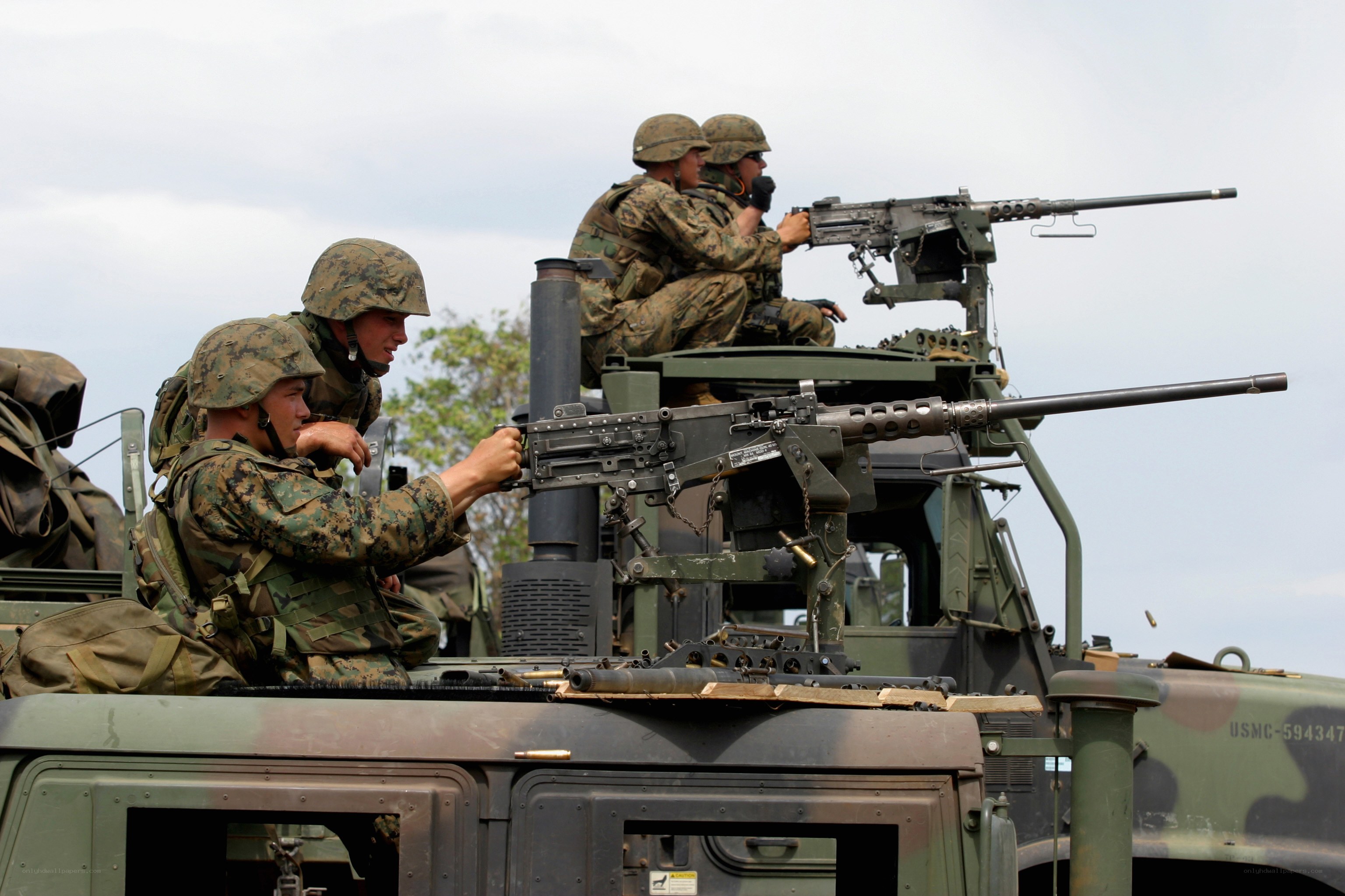 Marines on armored vehicle