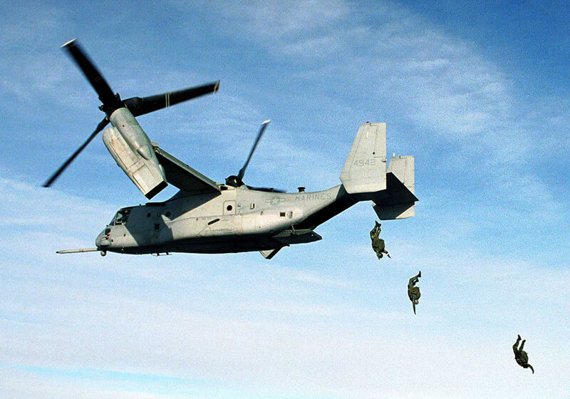 Marines parachuting from Osprey