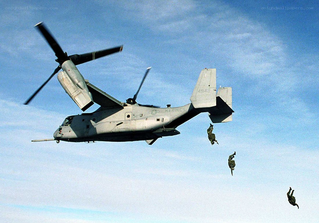 Marines parachuting from Osprey