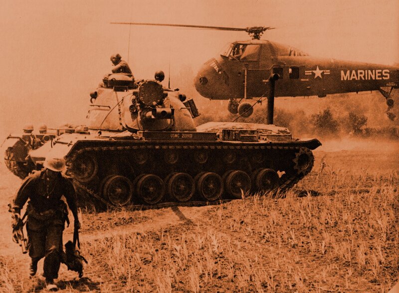 Marines with tank and helicopter