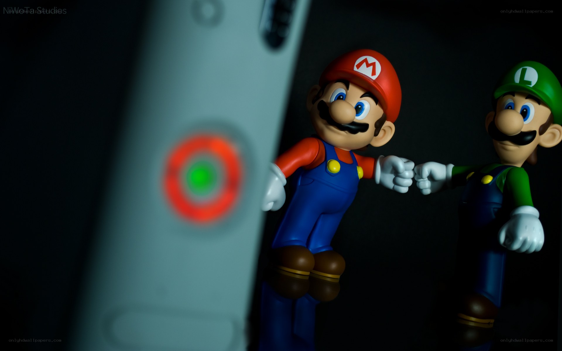 Mario and Luigi figurines with controller