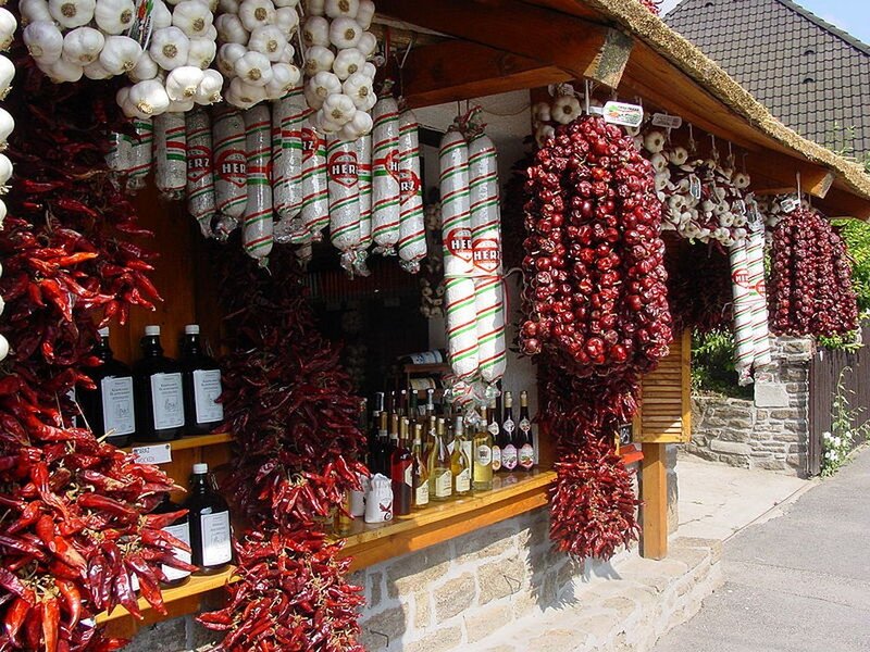 Market stall with dried peppers and sausages