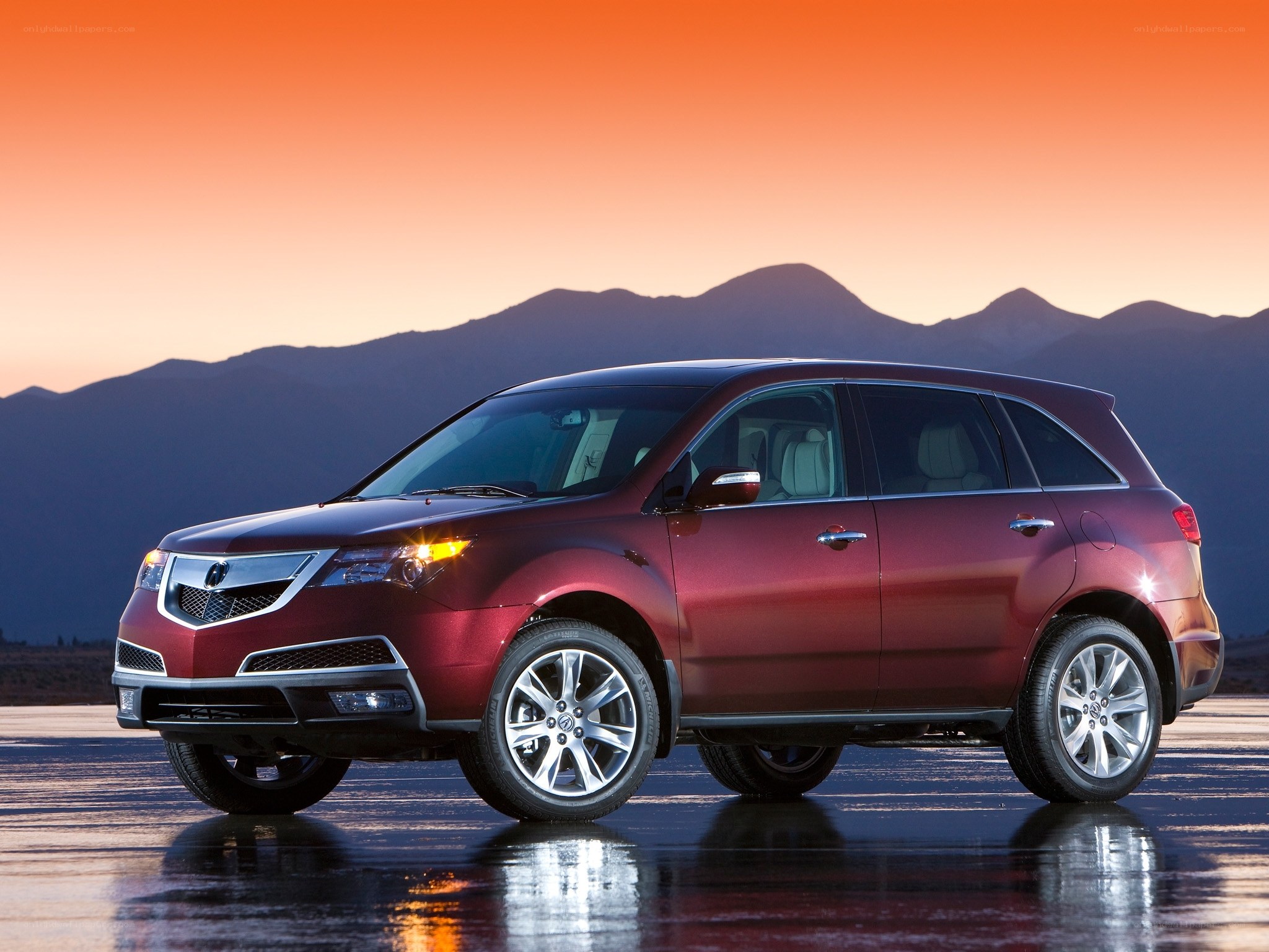 Maroon Acura MDX at sunset
