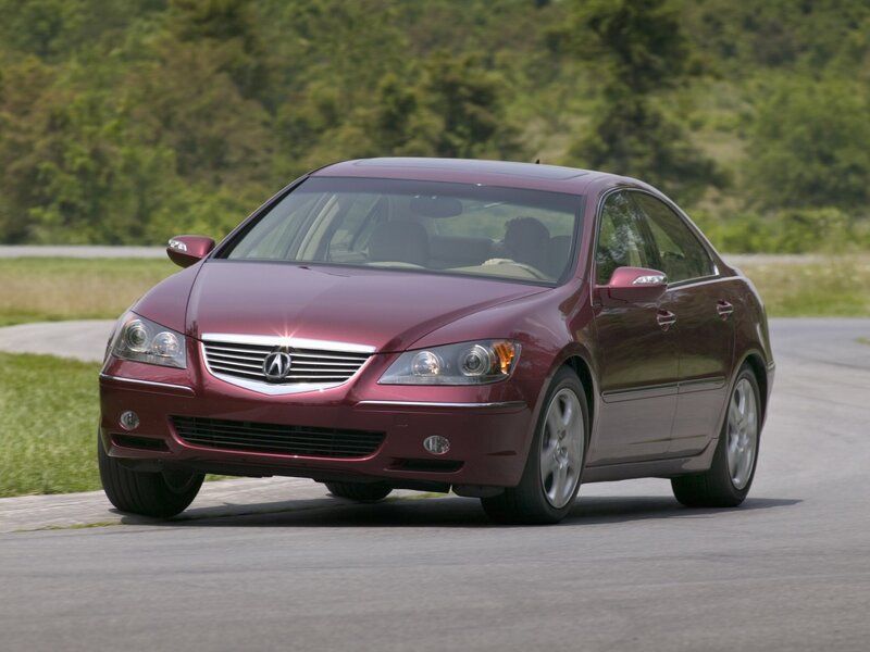 Maroon Acura RL driving on road