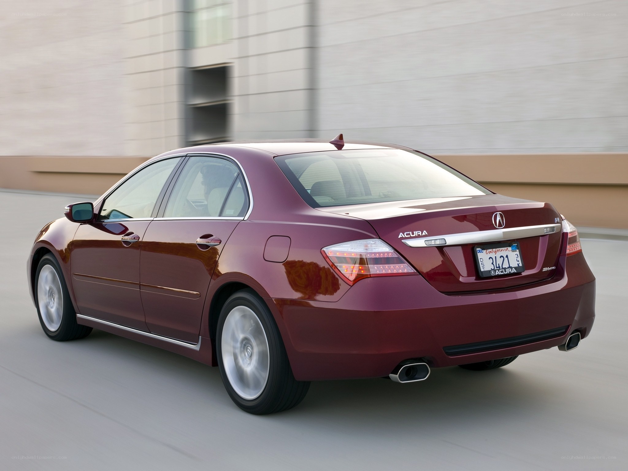 Maroon Acura RL in motion