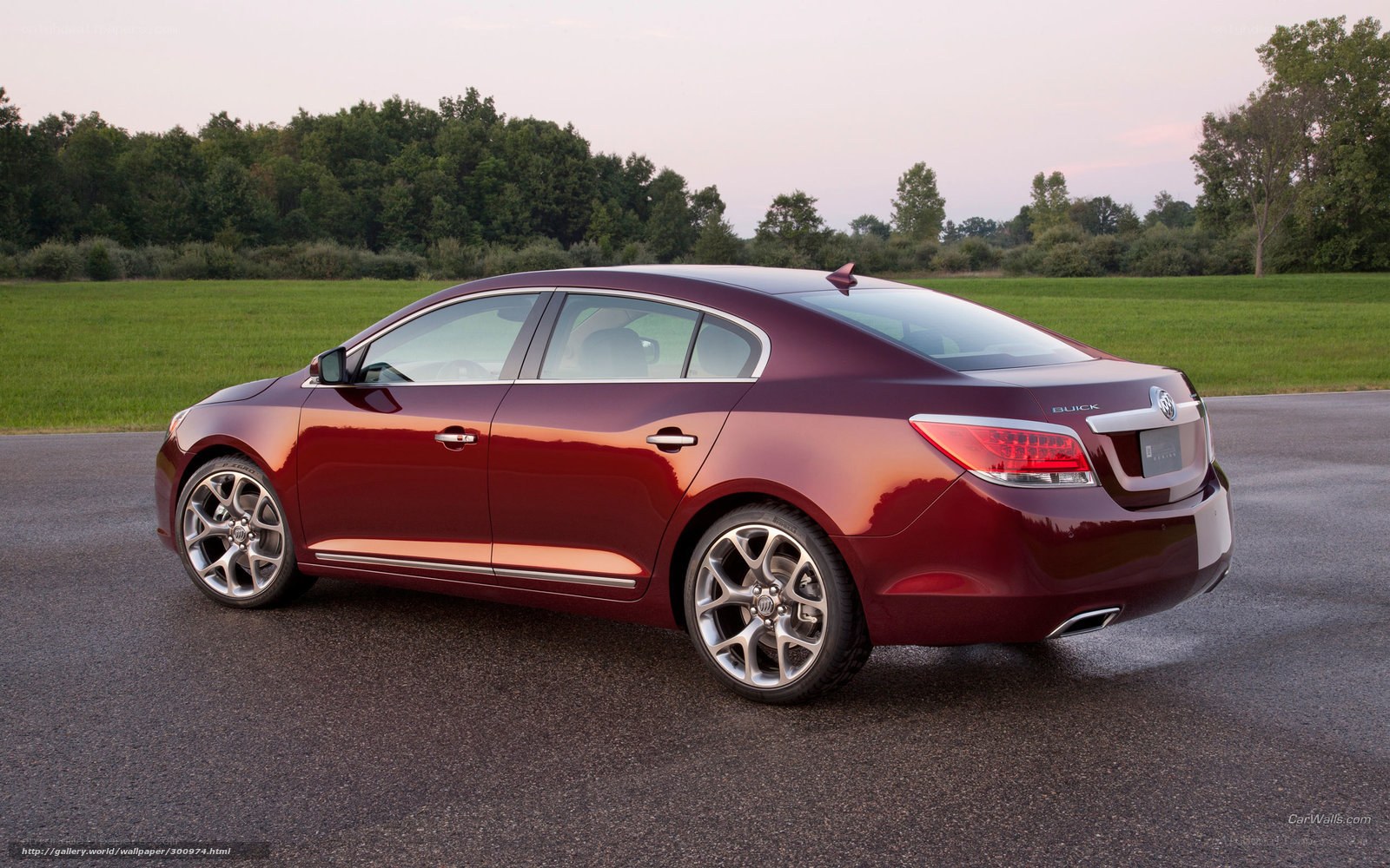 Maroon Buick sedan on road