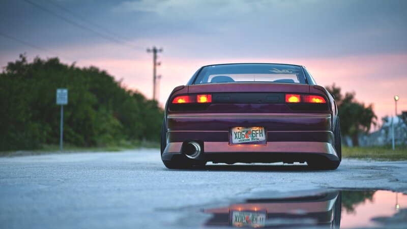 maroon car at dusk