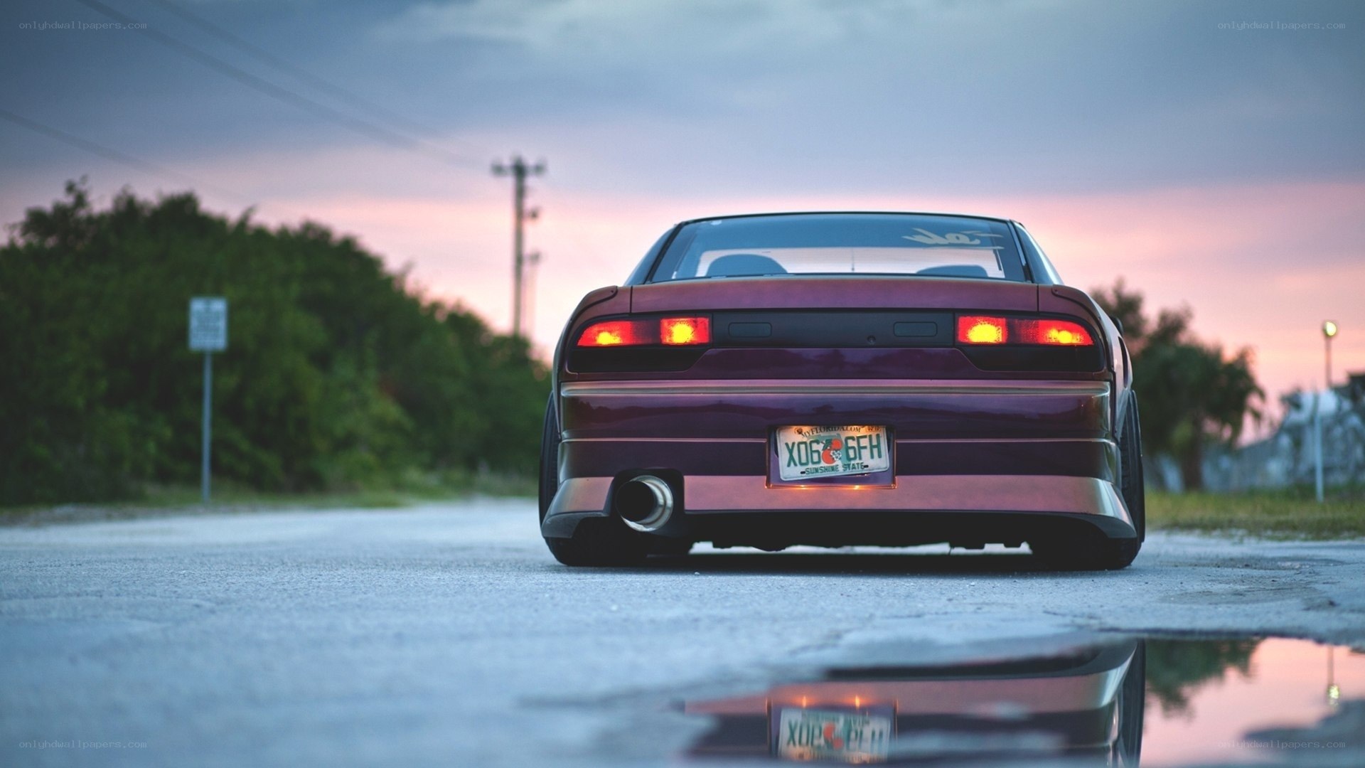 maroon car at dusk