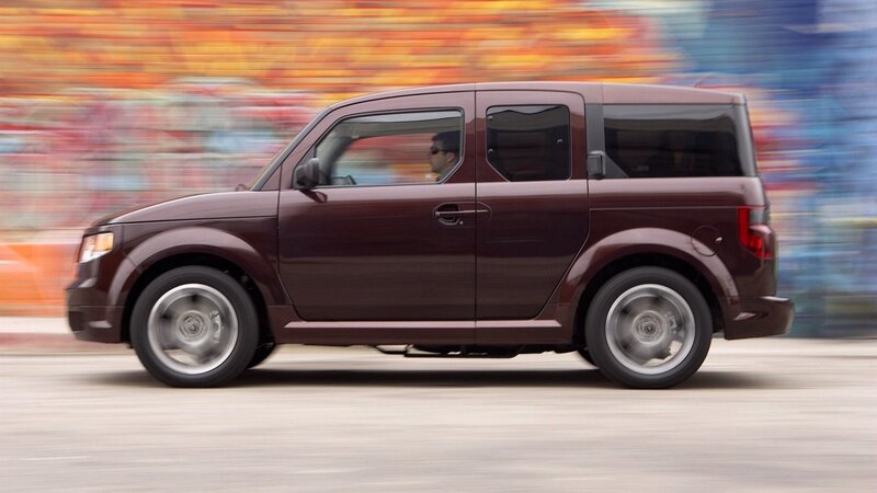 Maroon car in motion