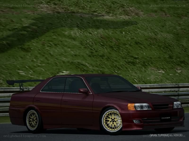 maroon car on racetrack