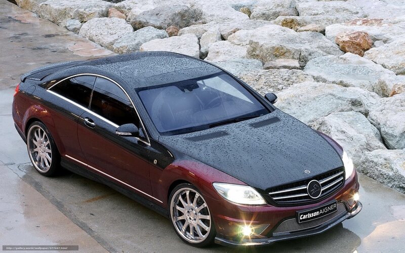 Maroon car on wet pavement