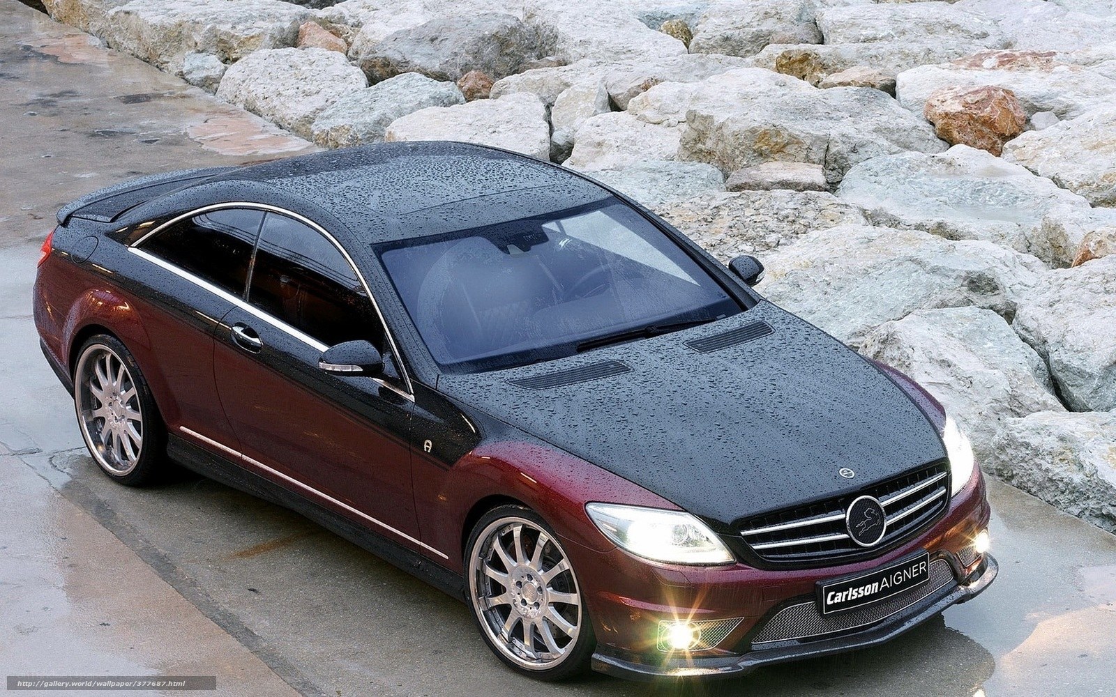 Maroon car on wet pavement