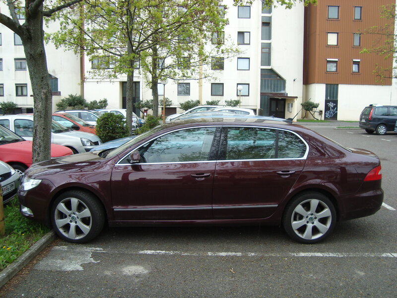 Maroon car parked in lot