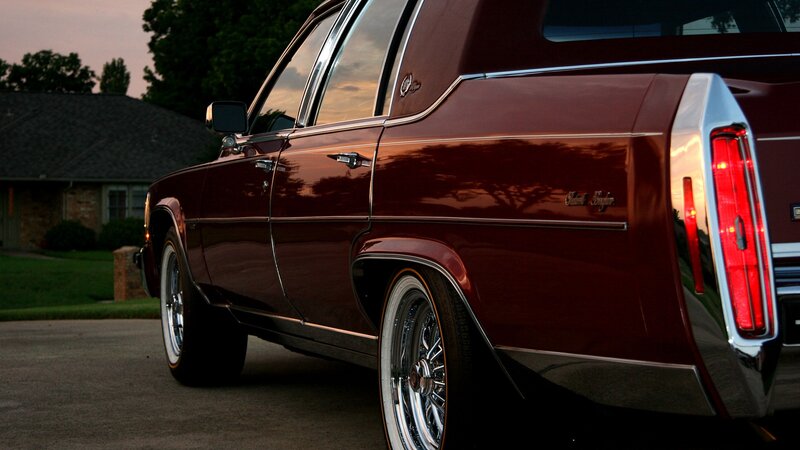 Maroon classic car at dusk