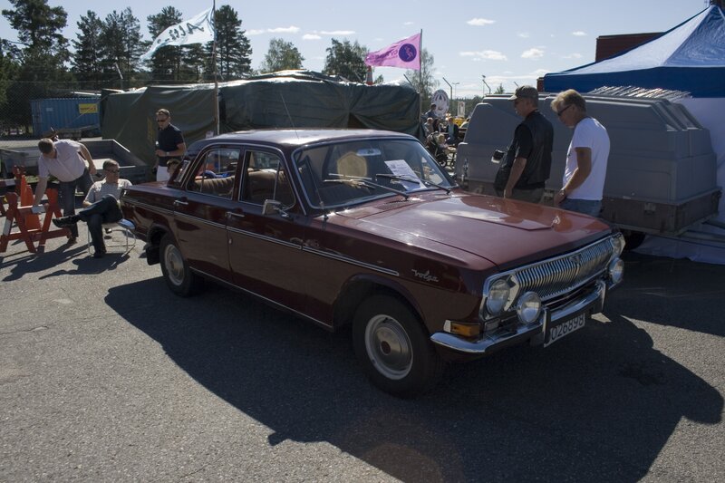 Maroon classic car at outdoor event