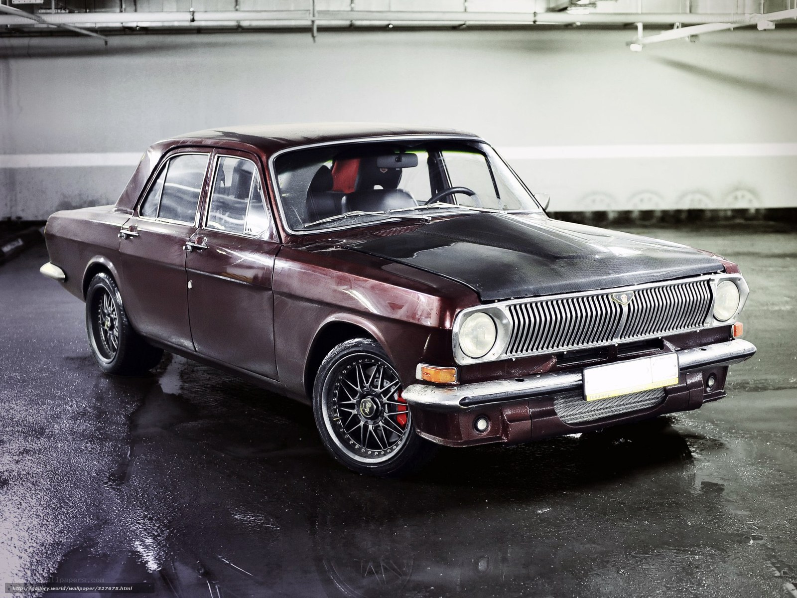 Maroon classic car in garage