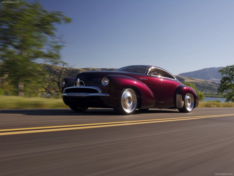 maroon classic car on road