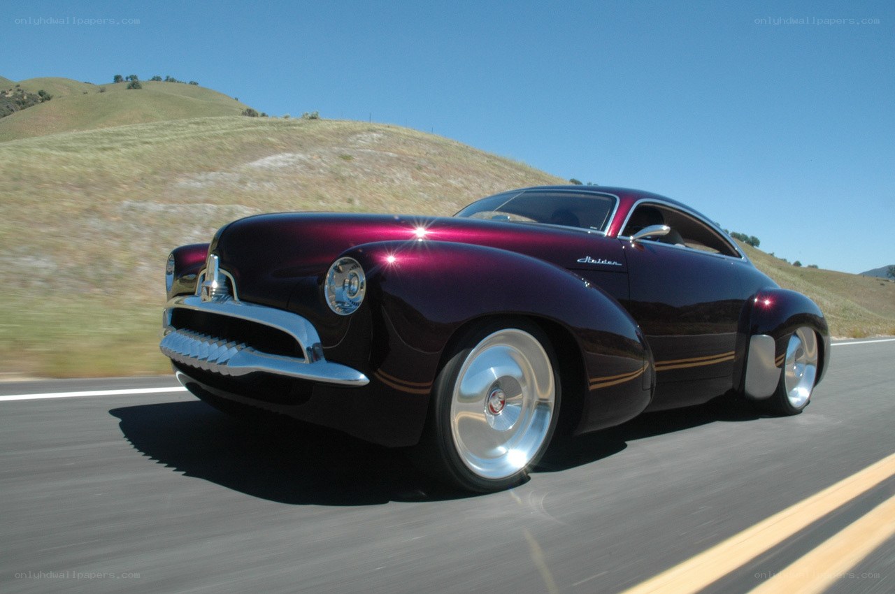 maroon classic car on road