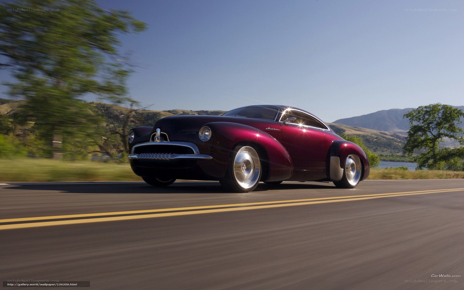 Maroon classic car on road