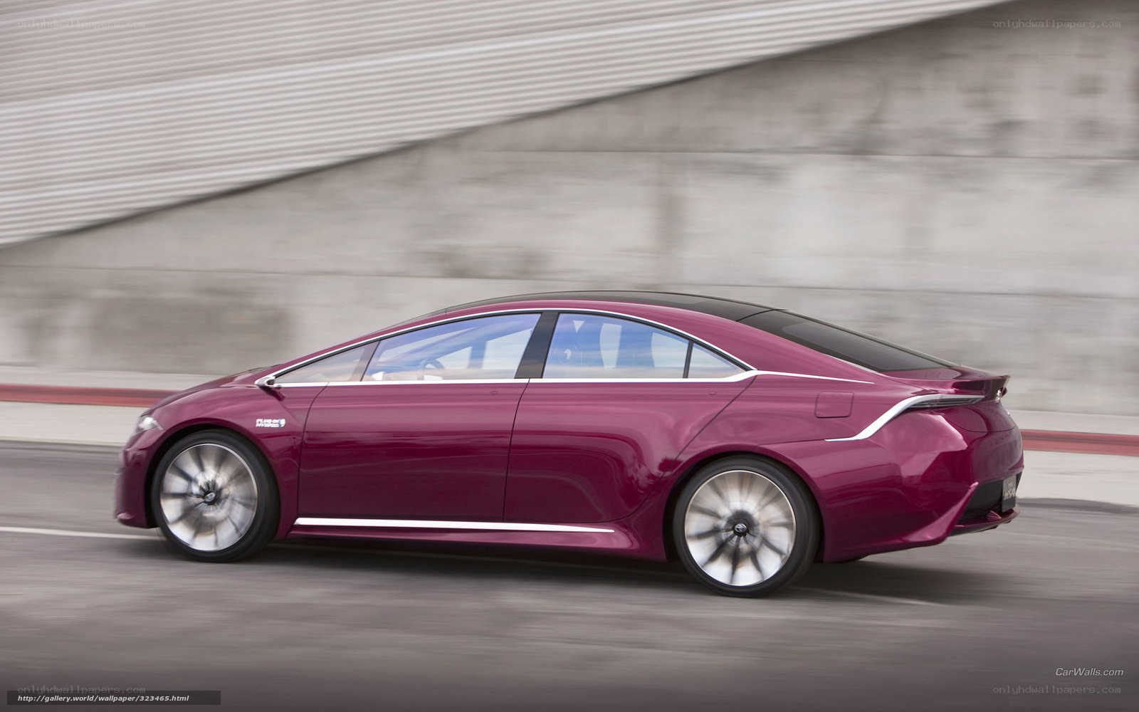 maroon concept car in motion
