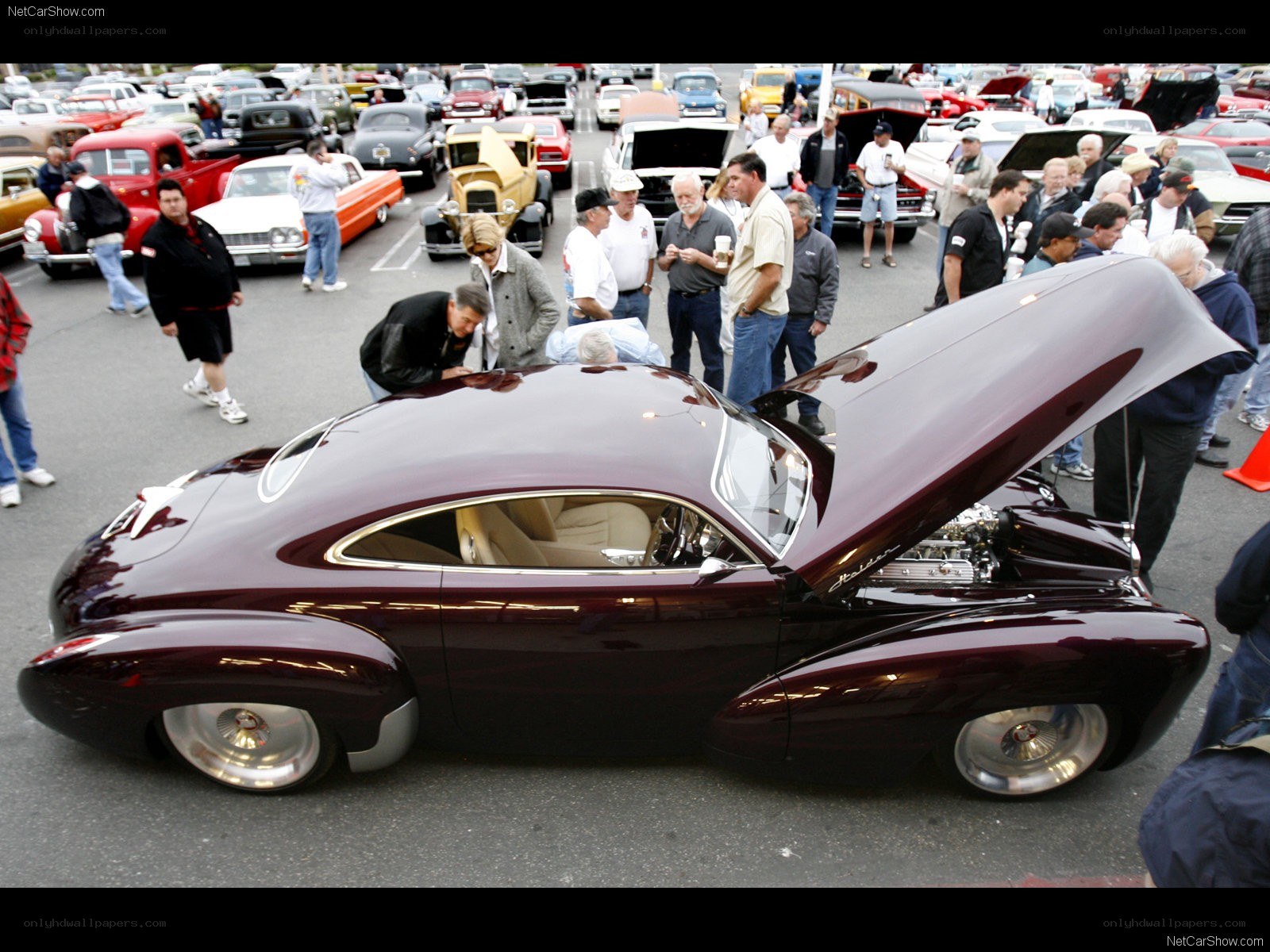Maroon custom car at a show