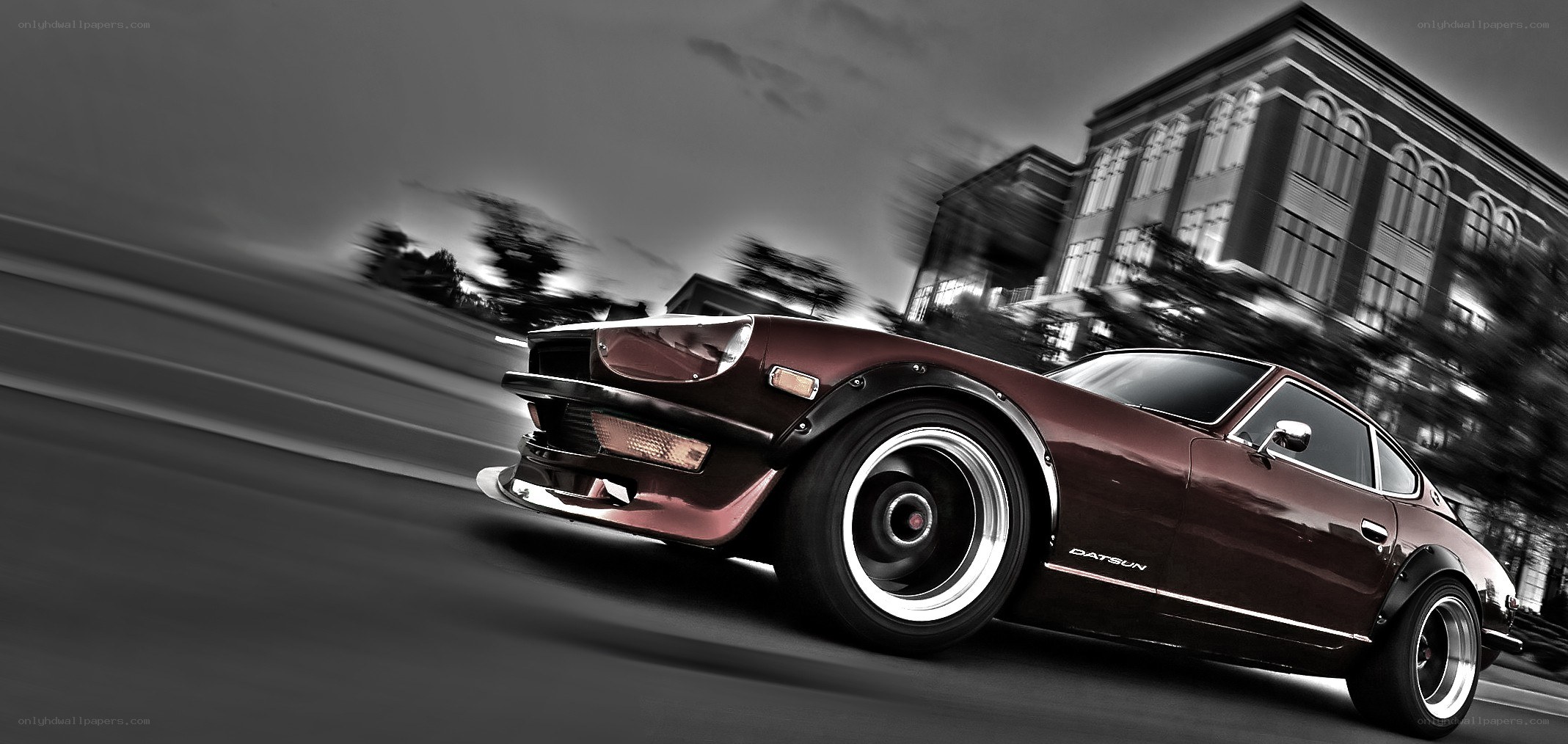 Maroon Datsun car in motion