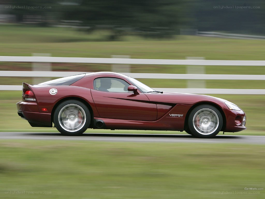 Maroon Dodge Viper in motion