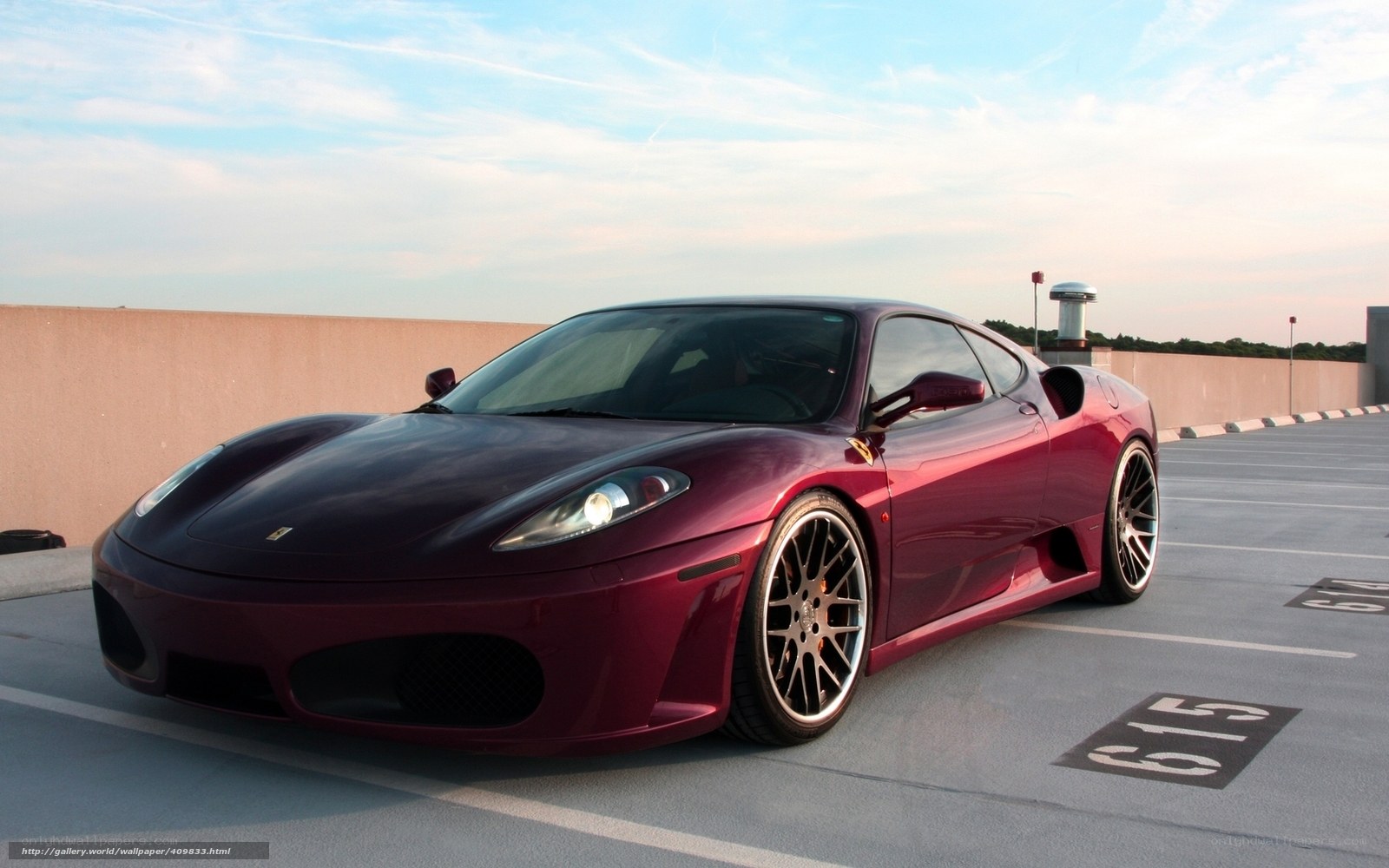 Maroon Ferrari parked on rooftop