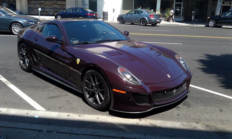 Maroon Ferrari parked on street
