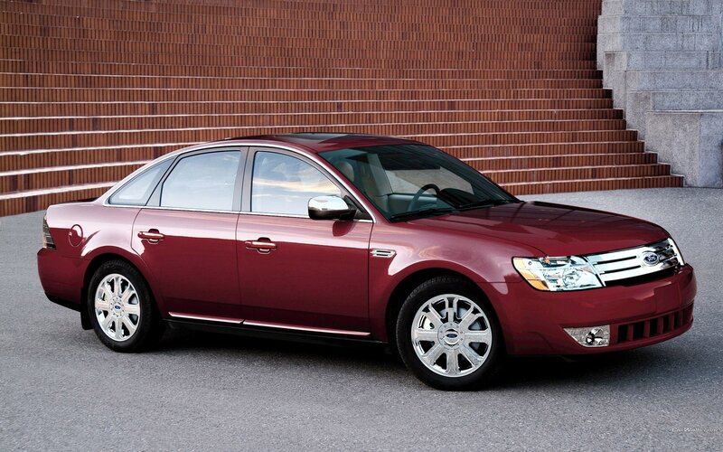 maroon ford taurus sedan