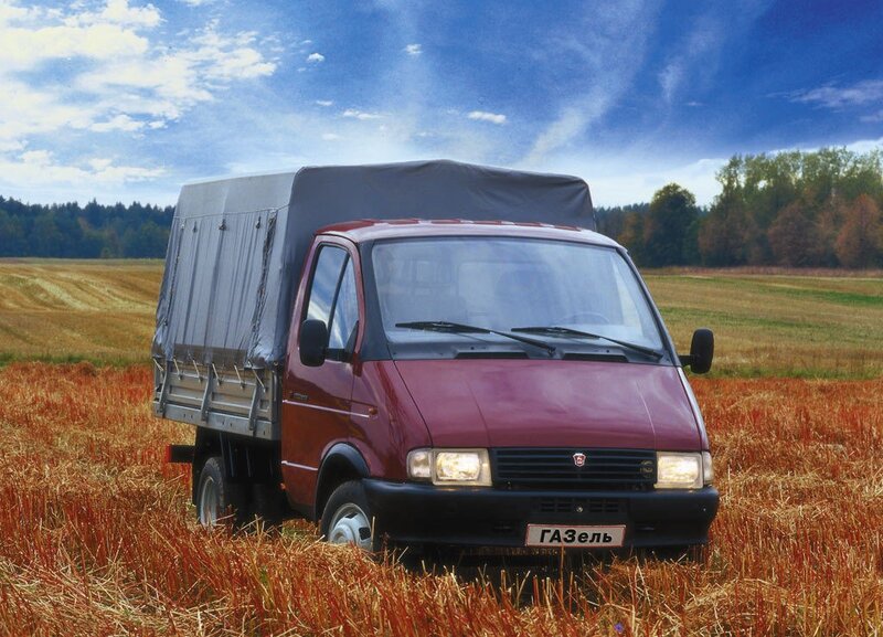 Maroon GAZEL truck in field