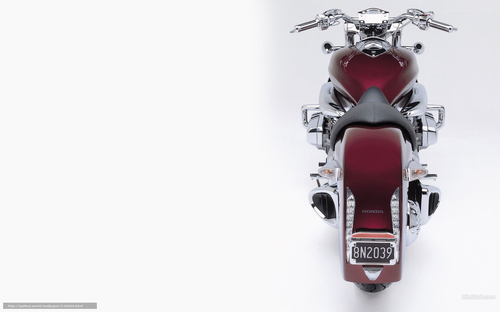 Maroon Honda motorcycle rear view